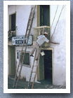 Painting front of pharmacy, Santa Domingo