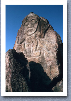 Pre-Colombian figure carved into stone overlooking Magdalena River