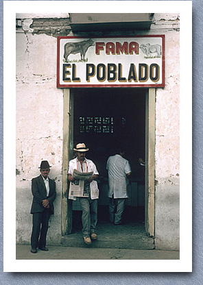 Chatting outside butchers, Salento