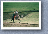 Husband and wife riding horse, Esperanza