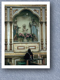 Woman praying to Jesus, Otavalo